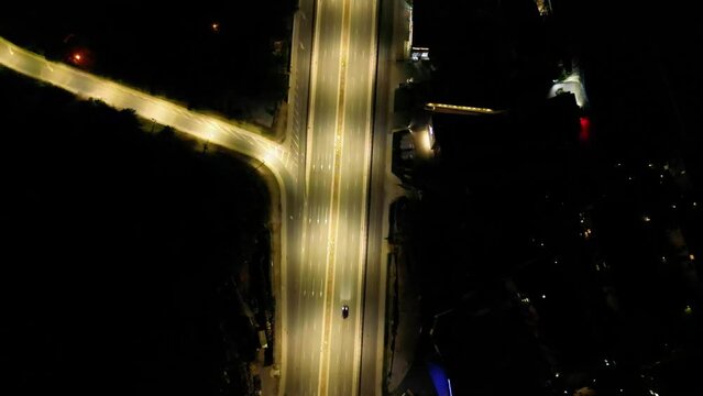 4k Aerial high angle footage of a multy level intersection with roundabout in Sofia Bulgaria. Drone shot of Traffic flowing along a city boulevard at night.
