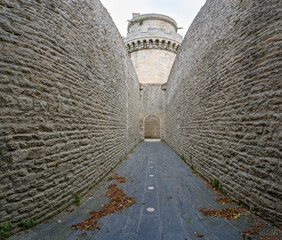 Alençon, France - 10 14 2023: View of the dungeon through a corridor of the Castle of the Dukes of Alençon.