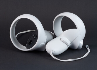 White vr controller on black background. © ED