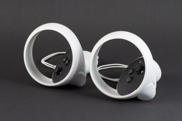 White vr controller on black background. © ED
