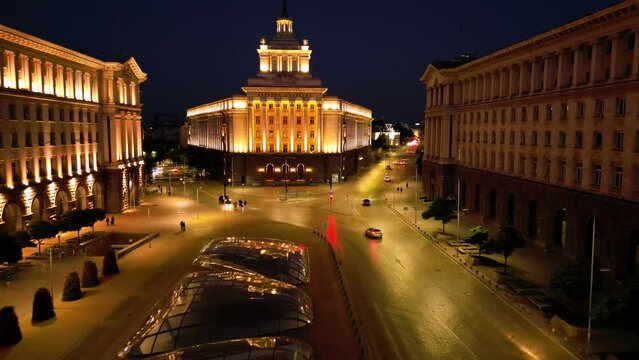 Aerial 4k drone night shot of the National Assembly in the Capital of Bulgaria - Sofia. High angle footage of Independance Square , the Presidency Bulgaria and the Counsil of Ministers of Bulgaria.
