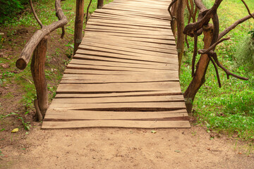 A beautiful little homemade wooden bridge in the middle of the forest