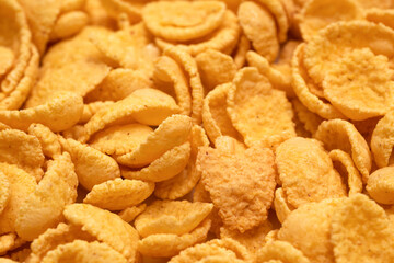 Background and texture of corn flakes close up.