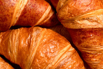Fresh French croissants close-up. Homemade baking background