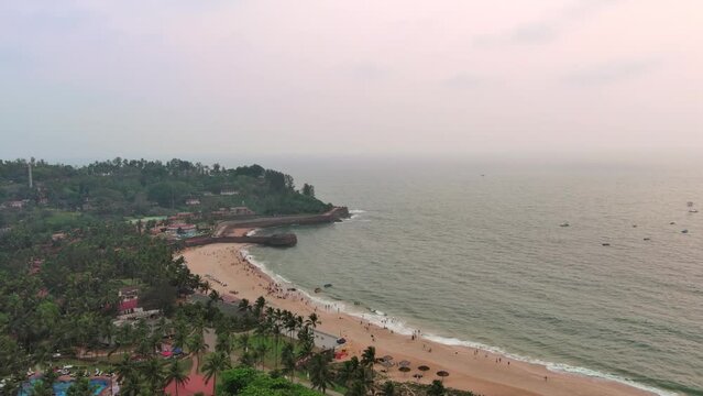 Goa, India: Aerial view of famous Indian summer resort by Arabian Sea, famous Sinquerim Beach and Sinquerim Fort at sunset - landscape panorama of South Asia from above