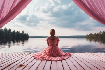 Foto auf Acrylglas girl in pink dress sit on jetty by lake © krissikunterbunt