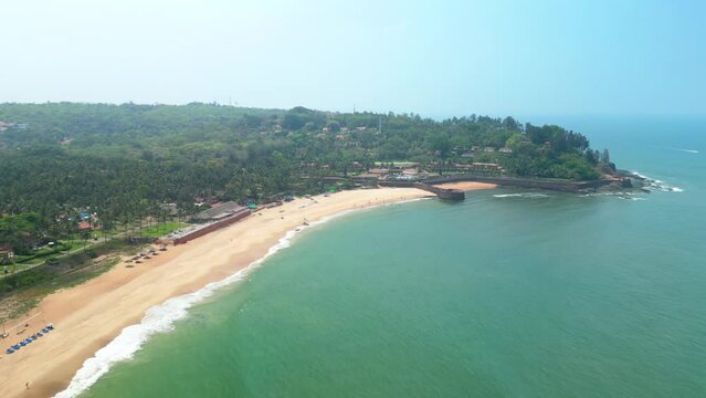 Goa, India: Aerial view of Indian summer resort by Arabian Sea, famous Sinquerim Beach and Sinquerim Fort - landscape panorama of South Asia from above