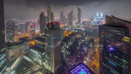 Panorama of futuristic skyscrapers in financial district business center in Dubai all night...
