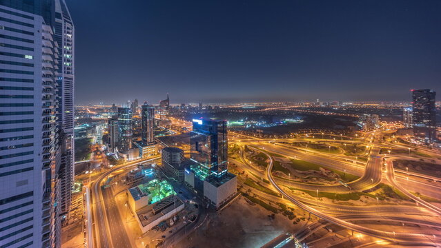 Aerial view of media city and al barsha heights district area all night timelapse from Dubai marina.