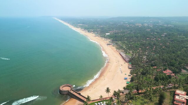 Goa, India: Aerial view of Indian summer resort by Arabian Sea, famous Sinquerim Beach and Sinquerim Fort - landscape panorama of South Asia from above