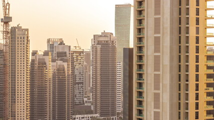 Obraz premium Skyscrapers at the Business Bay in Dubai aerial all day timelapse, United Arab Emirates