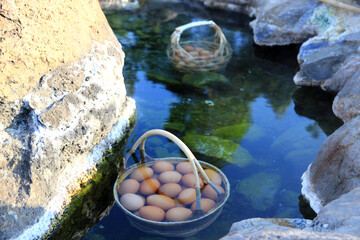 eggs boiling in the natural hot spring in National Park Chae Son.