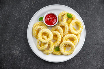onion rings in batter deep fryer tomato sauce fast food delicious eating cooking appetizer meal...