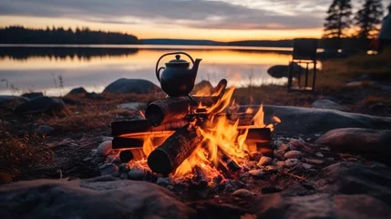 Rolgordijnen Coffee brewing on a campfire in camping outdoor. © visoot
