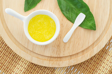 Homemade lemon, honey and sugar scrub for face, foot and body. Natural beauty treatment and spa recipe.