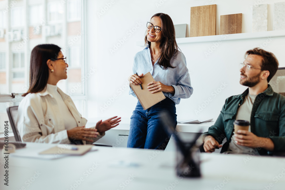 Poster Team of design professionals having a meeting in an office