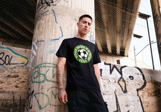 Mockup of man wearing t-shirt with customizable with graffiti