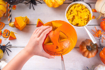 Preparation for Halloween with carving pumpkin