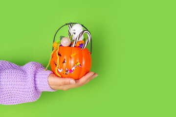 Pumpkin bucket with halloween candy