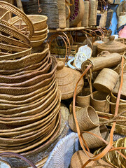 Household appliances, including baskets, tissue holders, placemats, and ornaments made of rattan at handicraft exhibitions.