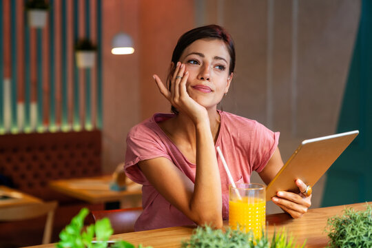 Portrait og happy woman using digital tablet for work, study or social media. People technology