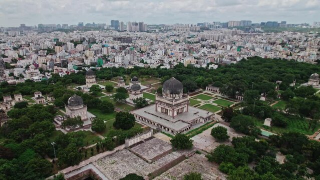 Qutub Shahi Tombs to city view hyderabad, telangana pull up drone shot  4k