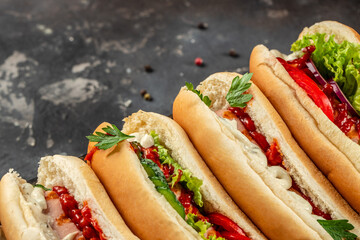 Set of various hot dogs on a dark background. top view. place for text