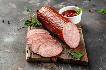 delicious salami, fresh sausages, Meat platter on a dark background. top view. place for text