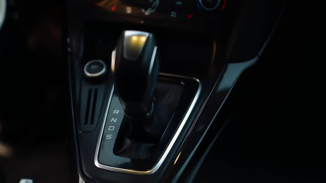 Close-up of Shifting a Gear. Car with Automatic Transmission Gearbox 