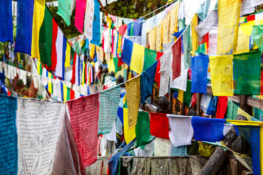 Colorful prayer flags on a bridge at Burning Lake a religious site in Jakar, Bumthang Valley, Bhutan, Asia