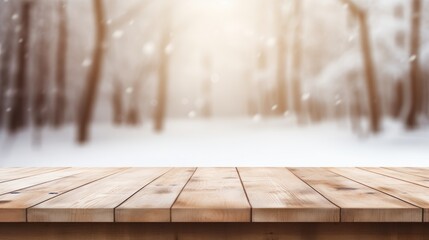 Empty light wood table top perspective and blurred snow forest background.