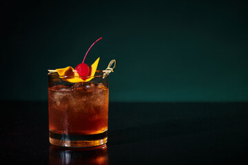 thirst quenching esthetic negroni with cherry full of ice on black backdrop, concept