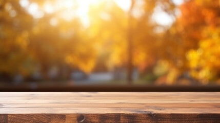Naklejka na ściany i meble Wooden table with a blurry golden tumn bokeh background