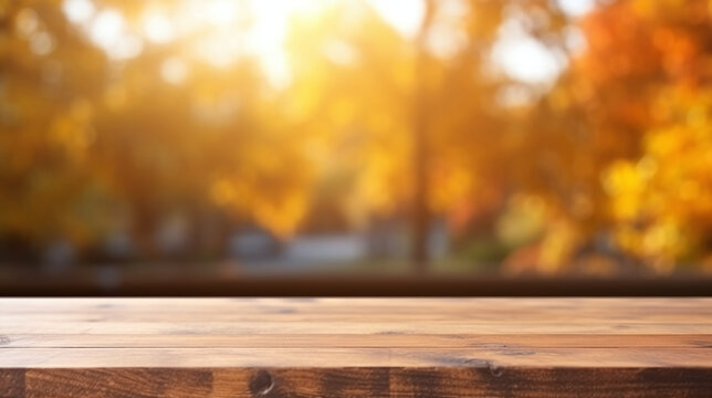 Wooden table with a blurry golden tumn bokeh background