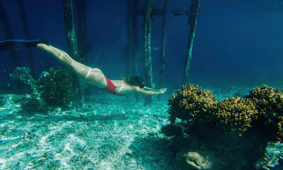  female exploring sea depths during snorkeling