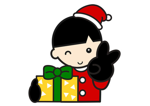 プレゼントをもらってピースサインのサンタ服の男の子