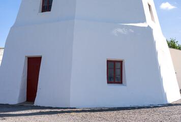 a beautiful anchient white windmill in aarsdale, Bornholm on a sunny day with blue sky