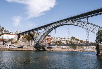 Fototapeta na wymiar Stunning view of a bridge stretching over a river in the city of Porto, Portugal