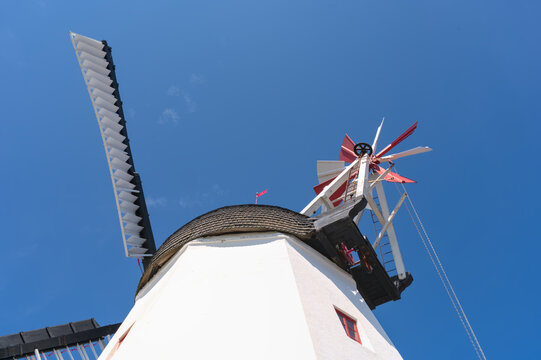 a beautiful anchient white windmill in aarsdale, Bornholm on a sunny day with blue sky