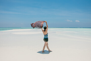 woman running on the beach