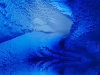 shades of turquoise and dark royal blue turbulent water and fluid blur