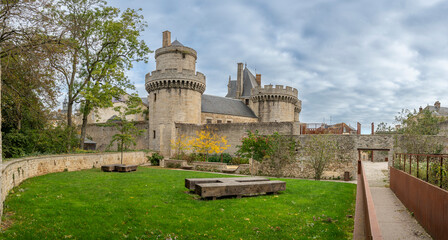Alençon, France - 10 14 2023: View of the ramparts and dungeons of the Castle of the Dukes of Alençon from the park. - obrazy, fototapety, plakaty