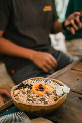 Healthy bowl of mango, banana, grains and seeds