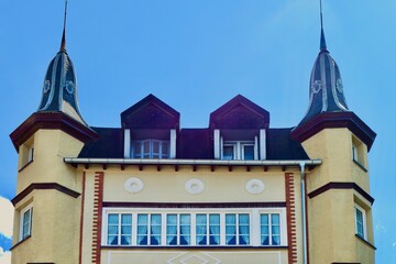 Corner of old-fashioned castle like house with cosy windows and tiny towers in Basque Country, Spain