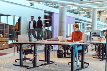 Fototapeta na wymiar In a modern startup office, a diverse group of young professionals collaboratively tackles various business problems and challenges, surrounded by their engaged colleagues, fostering innovation and