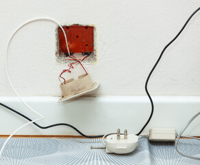 Fiber optic cable passage in the apartment with replacement of the traditional telephone socket.