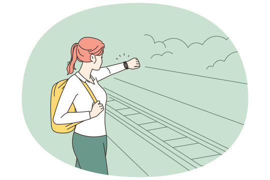 Woman on platform experience train delay 