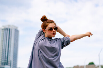 young street hip hop dancer in sportswear doing warm up before dance rehearsal hobby active lifestyle