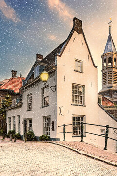 Winter view with snowfall of a street in the ancient city center of Amersfoort, The Netherlands