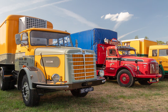 Row of colorful vintage trucks on a country fair in Aalten, The Netherlands on June 23, 2023